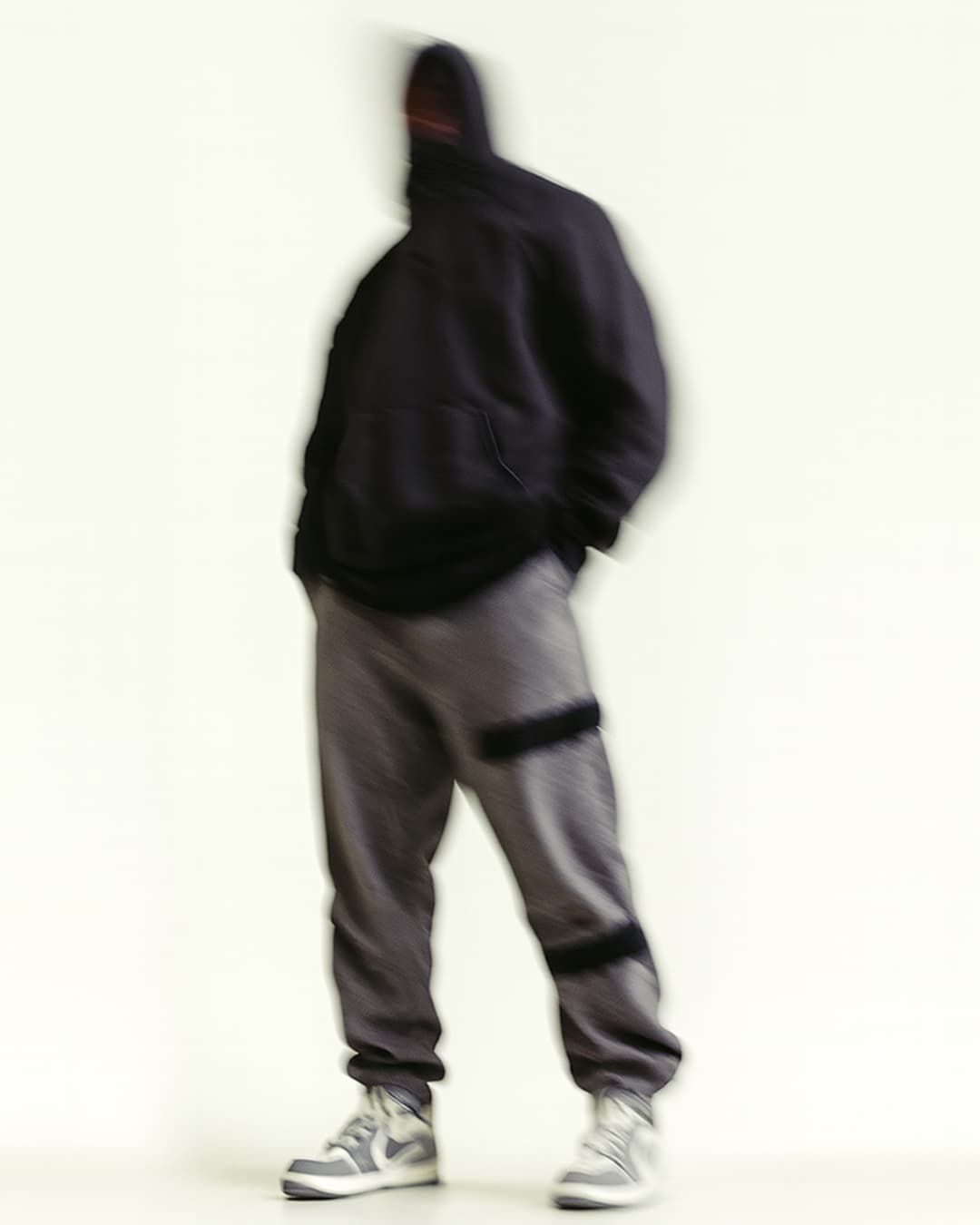 Finlo editorial - person in black hoodie and gray pants